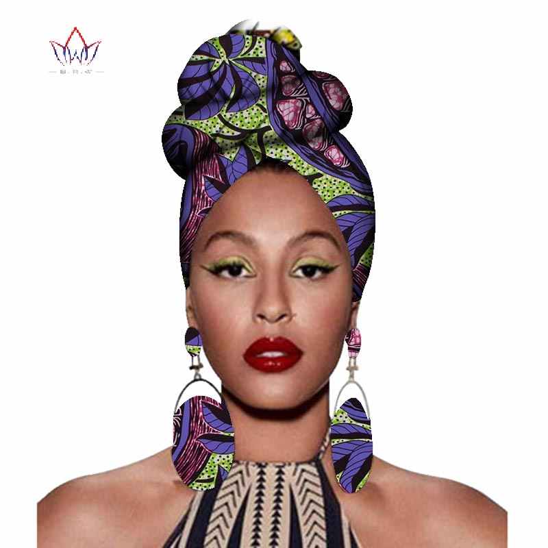 lady rocks African head gear matching with bold earrings