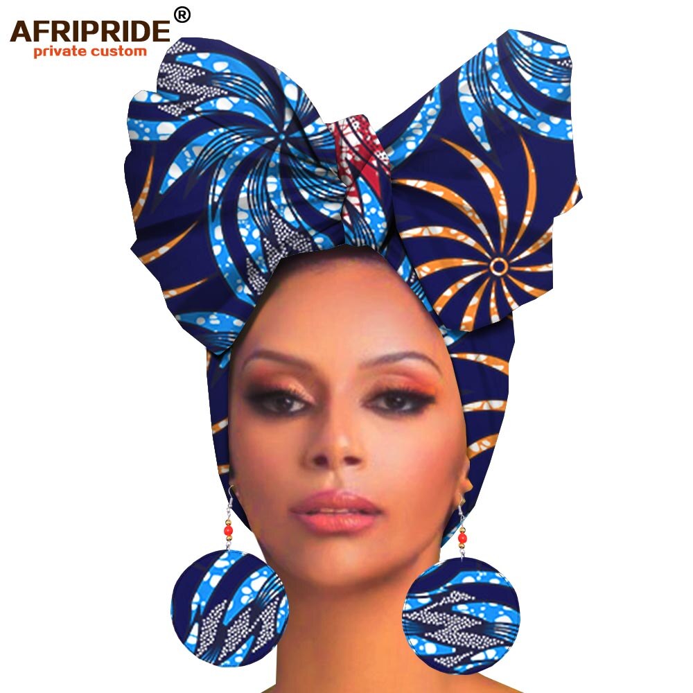 lady rocks matching African head gear and bold earrings